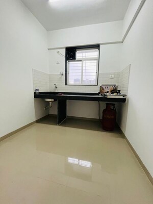 Kitchen in 1 BHK Apartment at Shri Jagdamba CHS, Wadgaon Sheri – for Rent