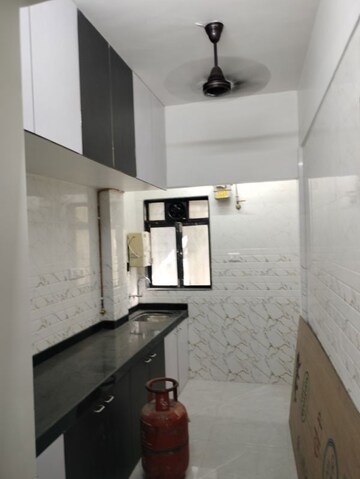 Kitchen in 1 BHK Apartment at Siddhivinayak CHS, Kharghar Sector 11 – for Sale