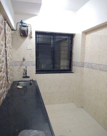 Kitchen in 1 BHK Apartment at K Raheja Palm Spring, Malad West – for Rent