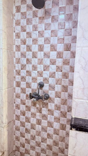 Bathroom in 3 BHK Apartment at Mahagun Mirabella, Sector 79 – for Rent