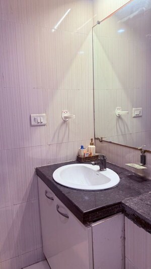 Bathroom in 3 BHK Apartment at Mahagun Mirabella, Sector 79 – for Rent