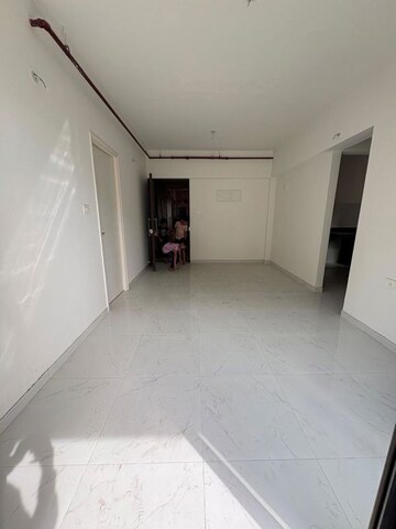 Living Room in 1 BHK Apartment at Runwal Gardens, Dombivli East – for Rent