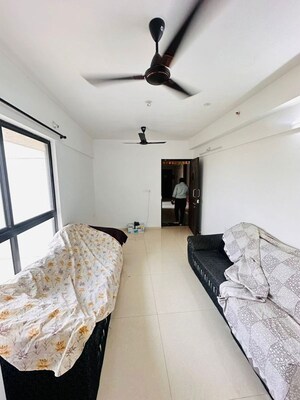 Living Room in 2 BHK Apartment at Lodha Lakeshore Greens, Dombivli East – for Rent