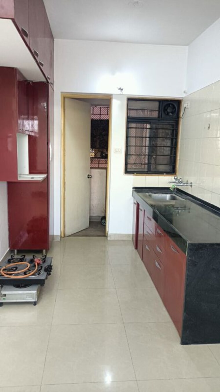 Kitchen, magarpatta-city-cosmos 2 Bedroom 980 Sq.Ft. Apartment In Magarpatta Road Pune 9724268