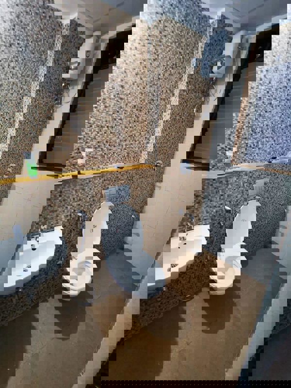 Bathroom in 1 BHK Apartment at Lodha Palava Downtown, Dombivli East – for Rent