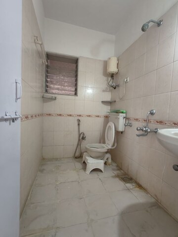 Bathroom in 1 BHK Apartment at Vedant Complex CHS, Samata Nagar – for Rent