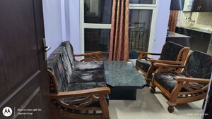 Living Room in 2 BHK Apartment at Aims Golf City, Sector 75 – for Rent