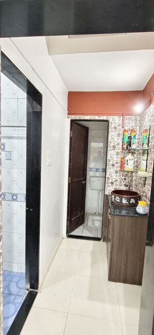 Building Lobby in 1 BHK Apartment at Wadgaon Sheri – for Rent