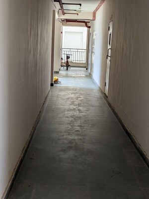 Building Lobby in 2 BHK Apartment at Amrapali Golf Homes, Sector 4 Greater Noida – for Sale