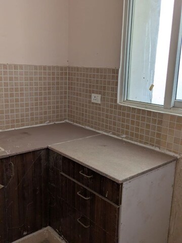 Kitchen in 2 BHK Apartment at Amrapali Golf Homes, Sector 4 Greater Noida – for Sale