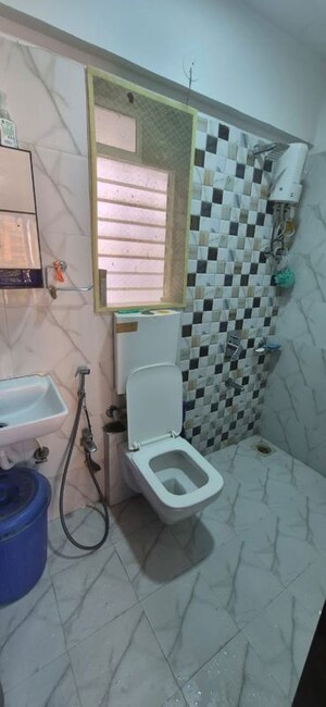 Bathroom in 2 BHK Apartment at Yash Laxman Niwas, Malad West – for Rent