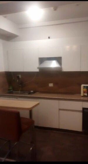 Kitchen in Studio Apartment at Nimbus The Golden Palm, Sector 168 – for Rent