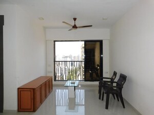 Living Room in 2 BHK Apartment at Earth Terrace, Goregaon West – for Rent