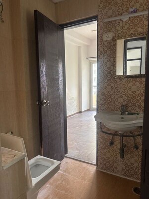 Bathroom in 3 BHK Apartment at Purvanchal Royal Park, Sector 137 – for Rent