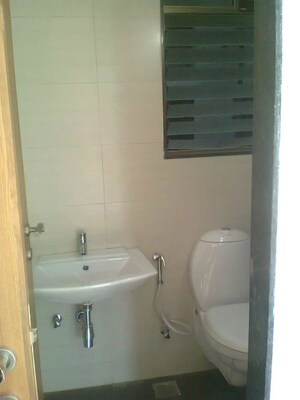Bathroom in 2 BHK Apartment at Andheri CHS, Andheri West – for Rent