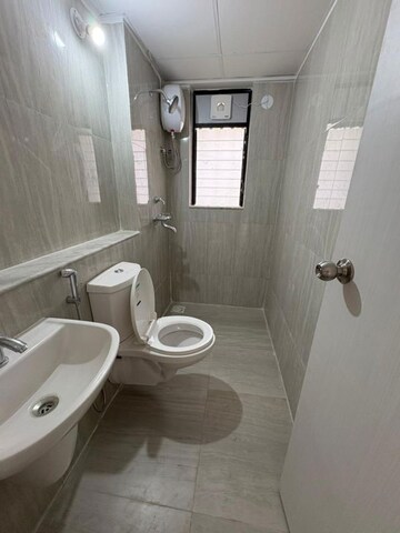 Bathroom in 1 BHK Apartment at Runwal Gardens Phase 3, Kalyan Shilphata Road – for Rent
