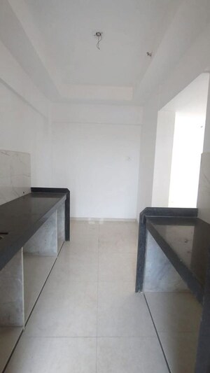 Kitchen in 2 BHK Apartment at Harmony Signature Towers, Owale – for Rent