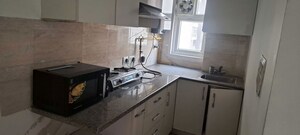 Kitchen in 1 BHK Apartment at Ajnara Daffodil, Sector 137 – for Rent