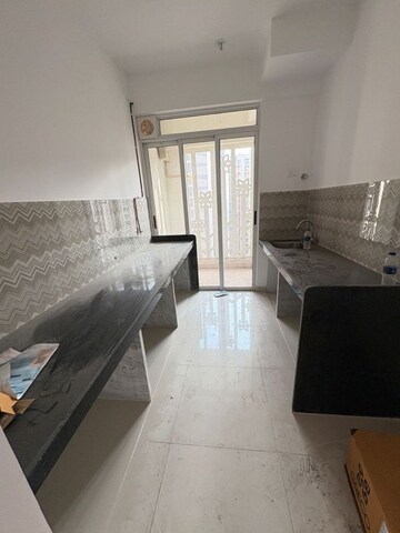 Kitchen in 2 BHK Apartment at Lodha Codename Premier, Mangaon – for Rent