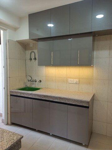 Kitchen in 2.5 BHK Apartment at Lotus Panache, Sector 110 – for Rent