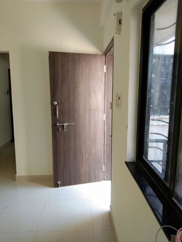 Living Room in 2 BHK Apartment at Ganeshnagar CHS, Kothrud – for Rent