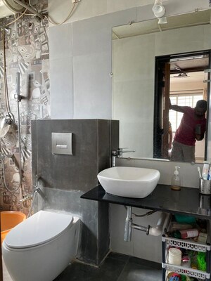 Bathroom in 3 BHK Apartment at Gangotree Prabhakar Smruti, Dahanukar Colony – for Rent