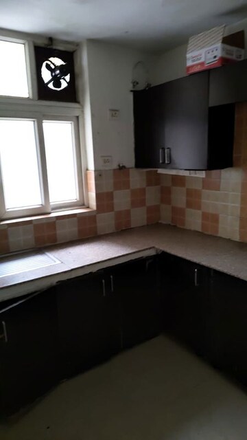 Kitchen in 2 BHK Apartment at Ansal Housing Woodbury, Patiala Road – for Rent