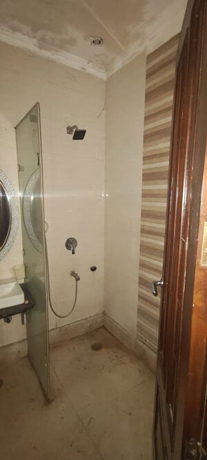 Bathroom in 4 BHK Builder Floor at Roop Nagar – for Rent