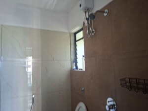 Bathroom in 1 BHK Apartment at Vihang Valley Phase 3, Kasarvadavali – for Rent