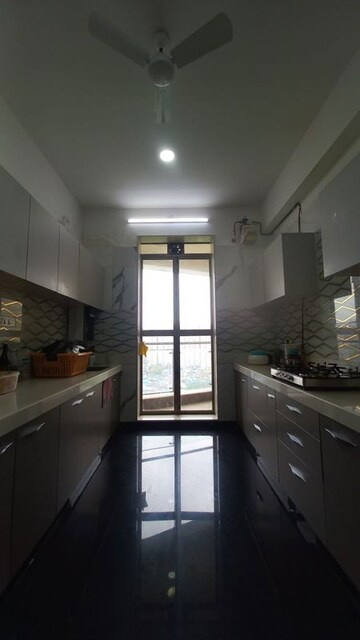 Kitchen in 3 BHK Apartment at Rustomjee Adarsh Excellency, Malad West – for Sale
