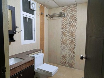 Bathroom in 3 BHK Apartment at Purvanchal Royal Park, Sector 137 – for Rent