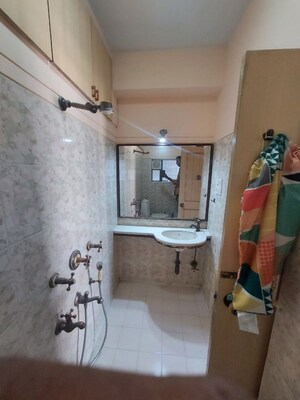 Bathroom in 2 BHK Apartment at Silver Sand CHS, Andheri West – for Rent