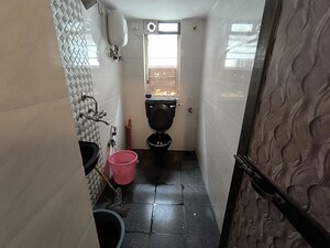 Bathroom in 2 BHK Apartment at Juhu Azad Nagar CHS, Andheri West – for Rent