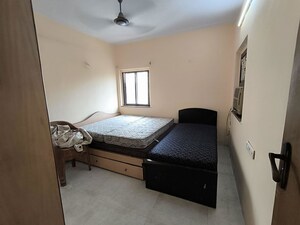 Bedroom in 2 BHK Apartment at Juhu Azad Nagar CHS, Andheri West – for Rent
