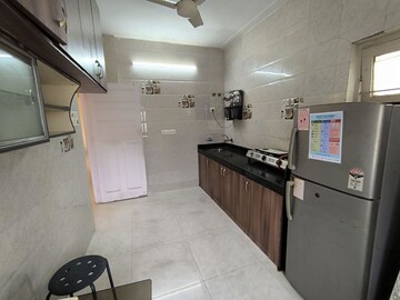 Kitchen in 2 BHK Apartment at Juhu Azad Nagar CHS, Andheri West – for Rent