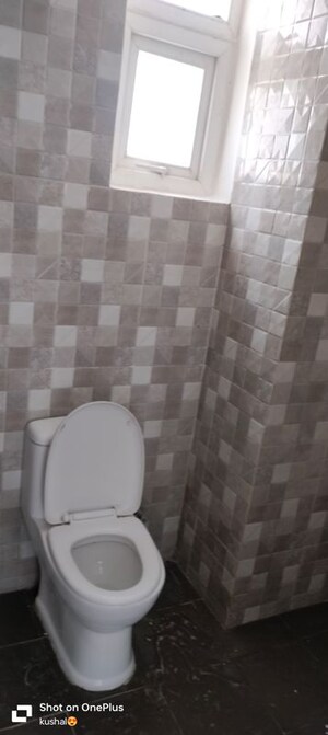 Bathroom in 2 BHK Apartment at Urban Axis Urban Woods, Sushant Golf City – for Rent