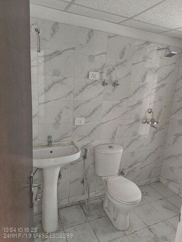 Bathroom in 2 BHK Apartment at Ajnara Panorama Facing F1, Sector 22 Yamuna Expressway – for Rent