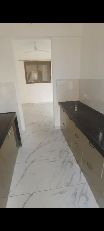 Kitchen in 2 BHK Apartment at Raymond Ten X Habitat, Pokhran Road No Two – for Rent