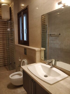 Bathroom in 4 BHK Apartment at Defence Colony – for Rent