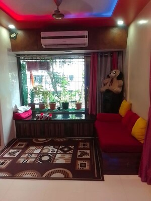 Living Room in 1 BHK Apartment at Salasar Bluebell CHS, Mira Road – for Sale