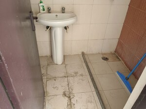 Bathroom in 2 BHK Apartment at Mahagun Mascot, Sain Vihar – for Rent