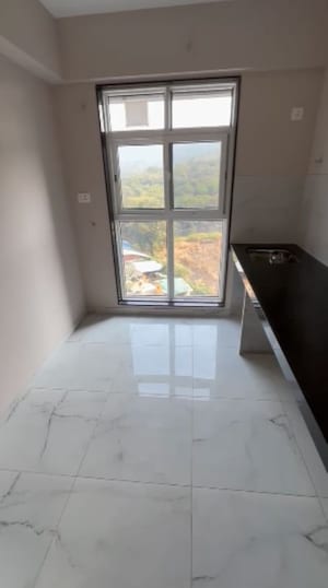 Kitchen in 1 BHK Apartment at MICL Aaradhya Parkwood, Mira Road – for Sale