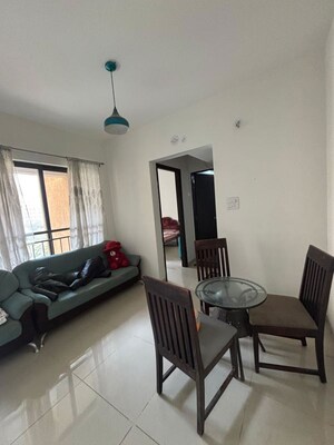 Living Room in 1 BHK Apartment at Shapoorji Pallonji Joyville Hinjewadi, Hinjewadi – for Rent