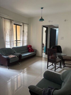 Living Room in 1 BHK Apartment at Shapoorji Pallonji Joyville Hinjewadi, Hinjewadi – for Rent