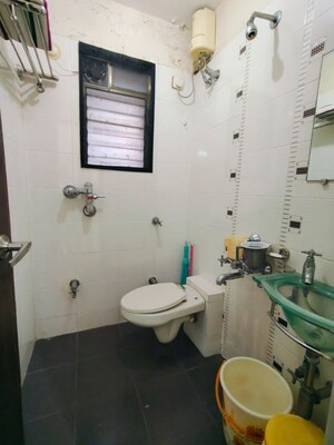 Bathroom in 2 BHK Apartment at Manshanti CHS, Borivali West – for Sale