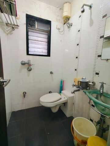 Bathroom in 2 BHK Apartment at Manshanti CHS, Borivali West – for Sale
