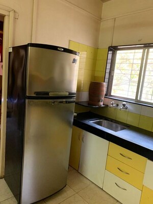 Kitchen in 2 BHK Apartment at Dhangauri Apartment, Dahanukar Colony – for Rent