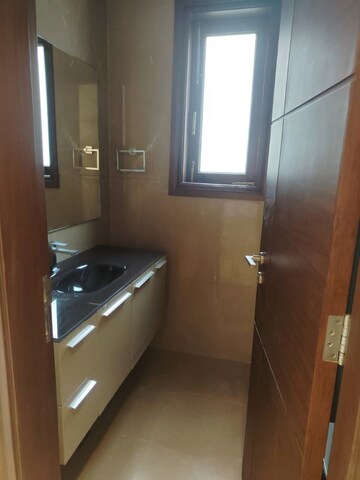 Bathroom in 4 BHK Apartment at Vasant Vihar – for Rent