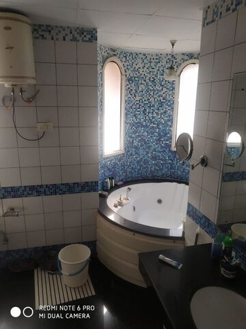 Bathroom in 4 BHK Apartment at Omaxe The Nile, Sector 49 – for Rent