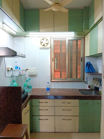 Kitchen in 1.5 BHK Apartment at Prabhat Upvan CHS, Gawand Baug – for Rent